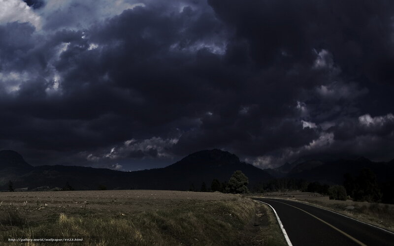Dark storm over mountain road