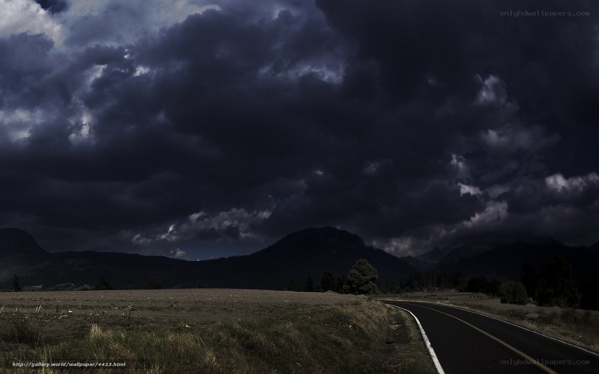 Dark storm over mountain road