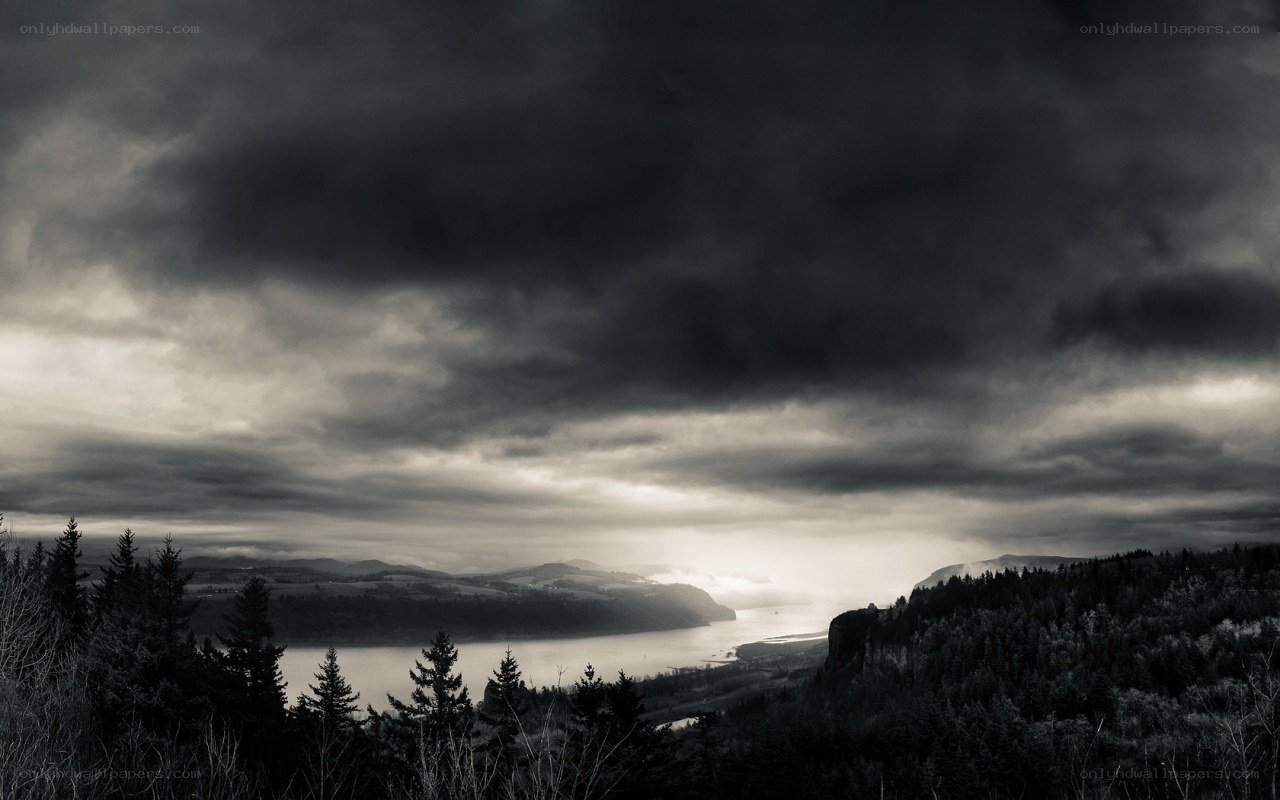 Dark storm over river valley