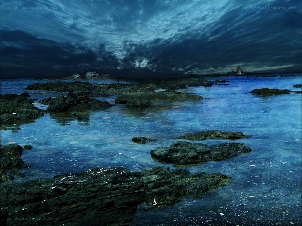Dark storm over rocky shore