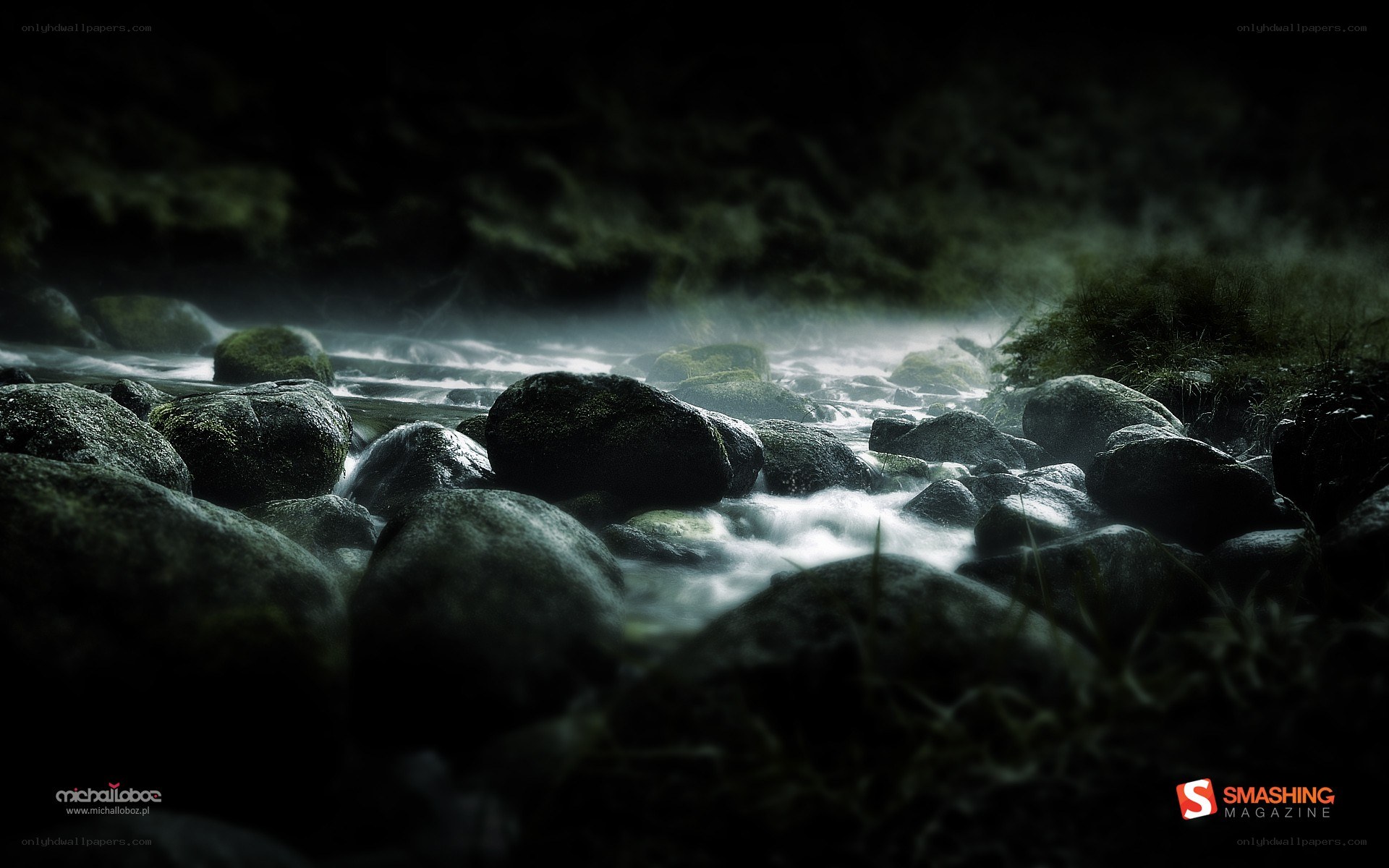 Dark stream flowing over rocks