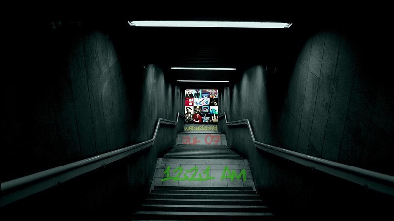 dark subway stairs with graffiti