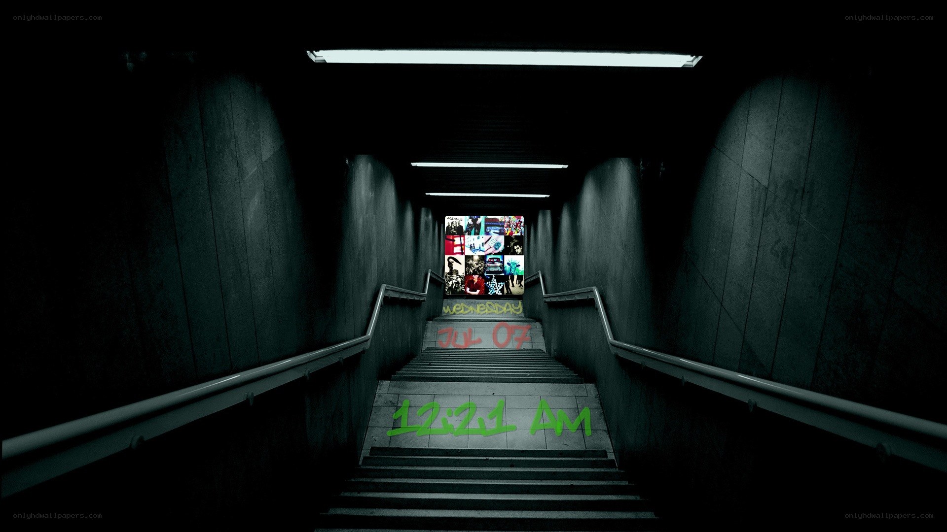 dark subway stairs with graffiti