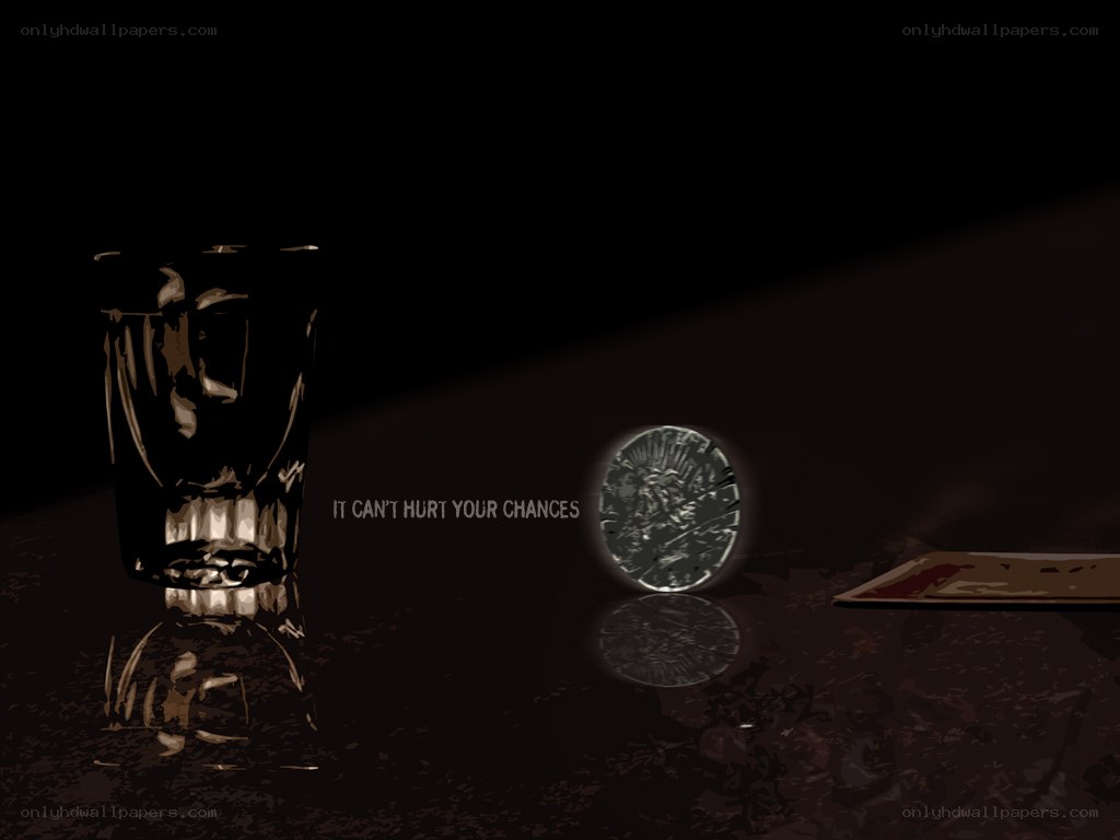 dark table with glass and coin
