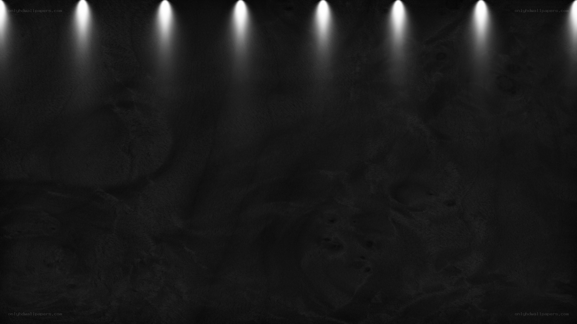 dark textured background with spotlights