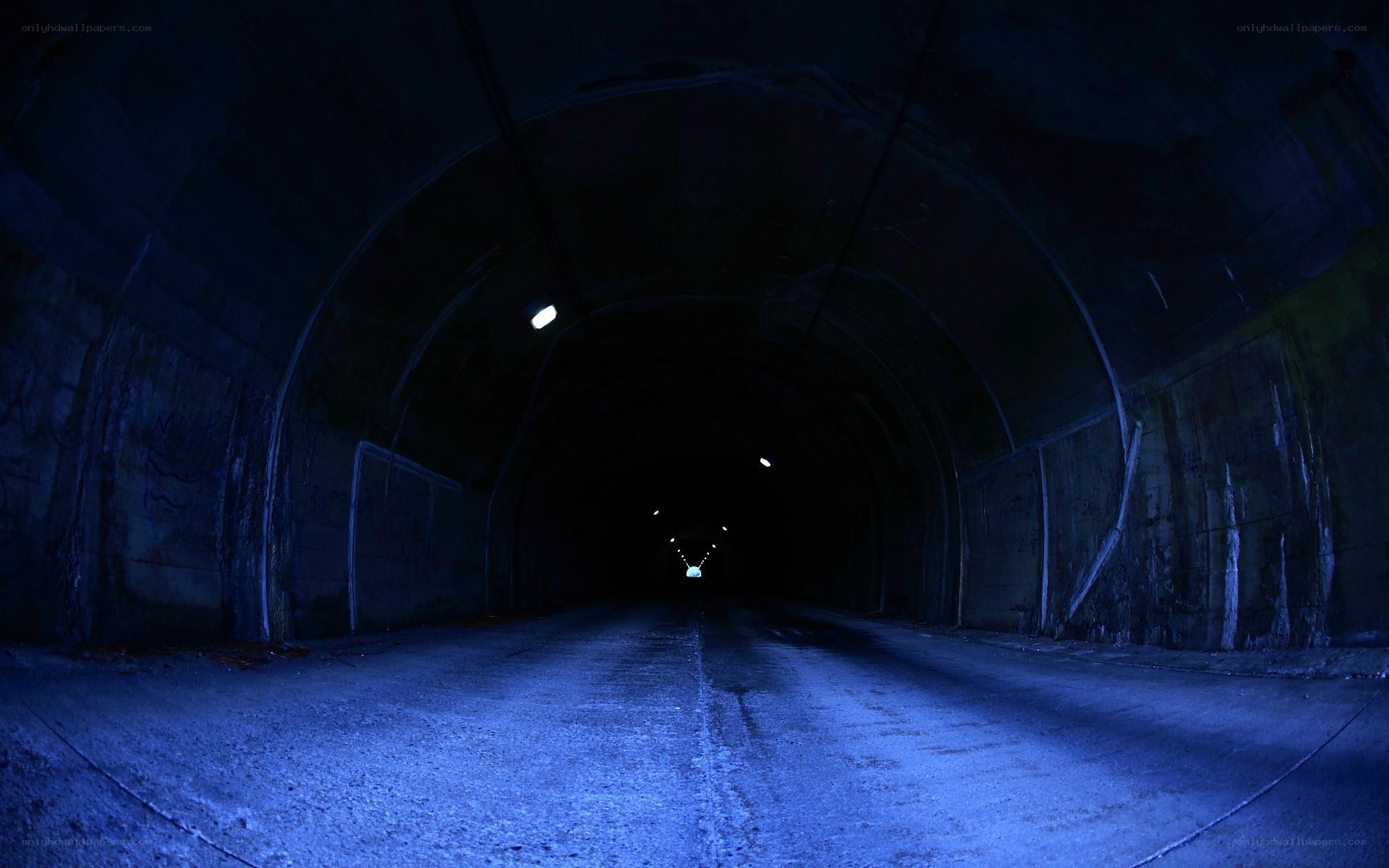 dark tunnel with blue lighting