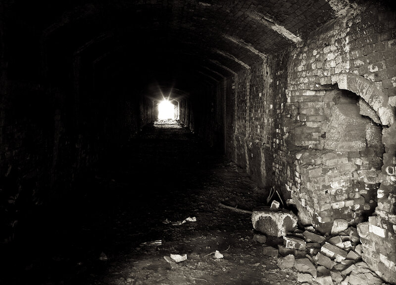 dark tunnel with light at end