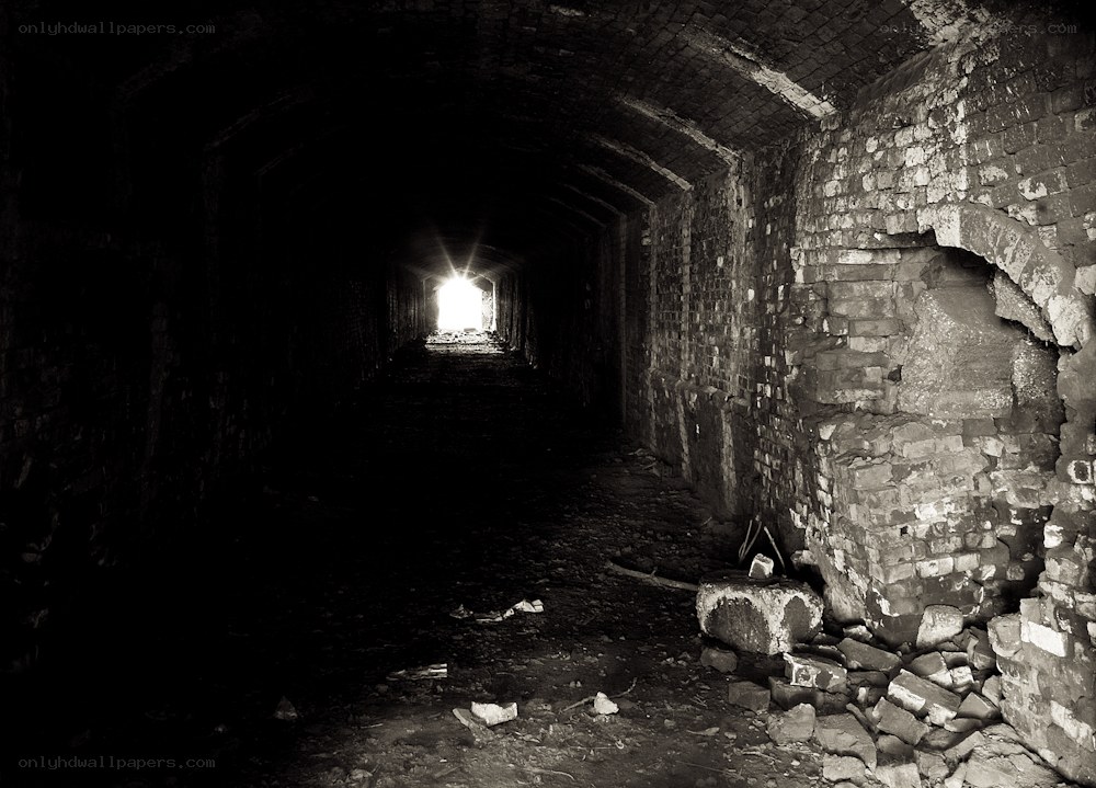 dark tunnel with light at end