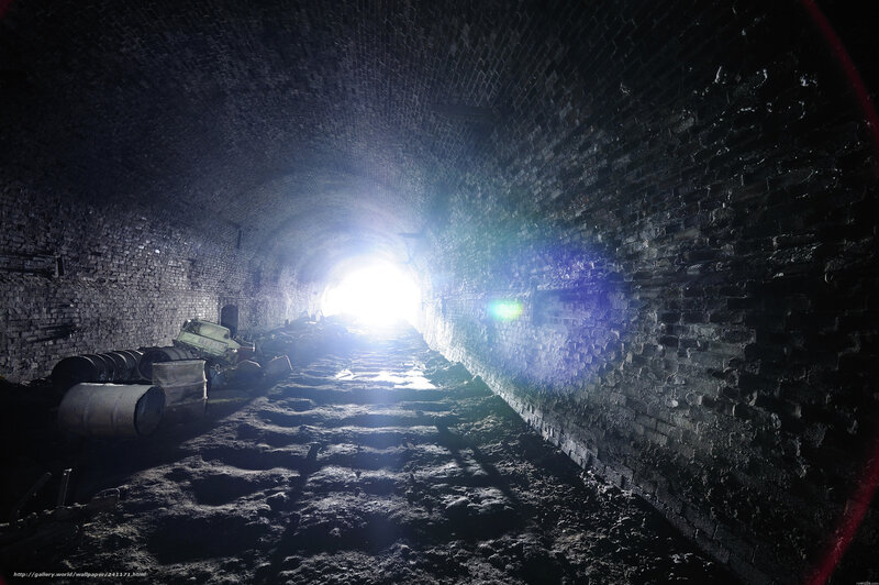 dark tunnel with light at end