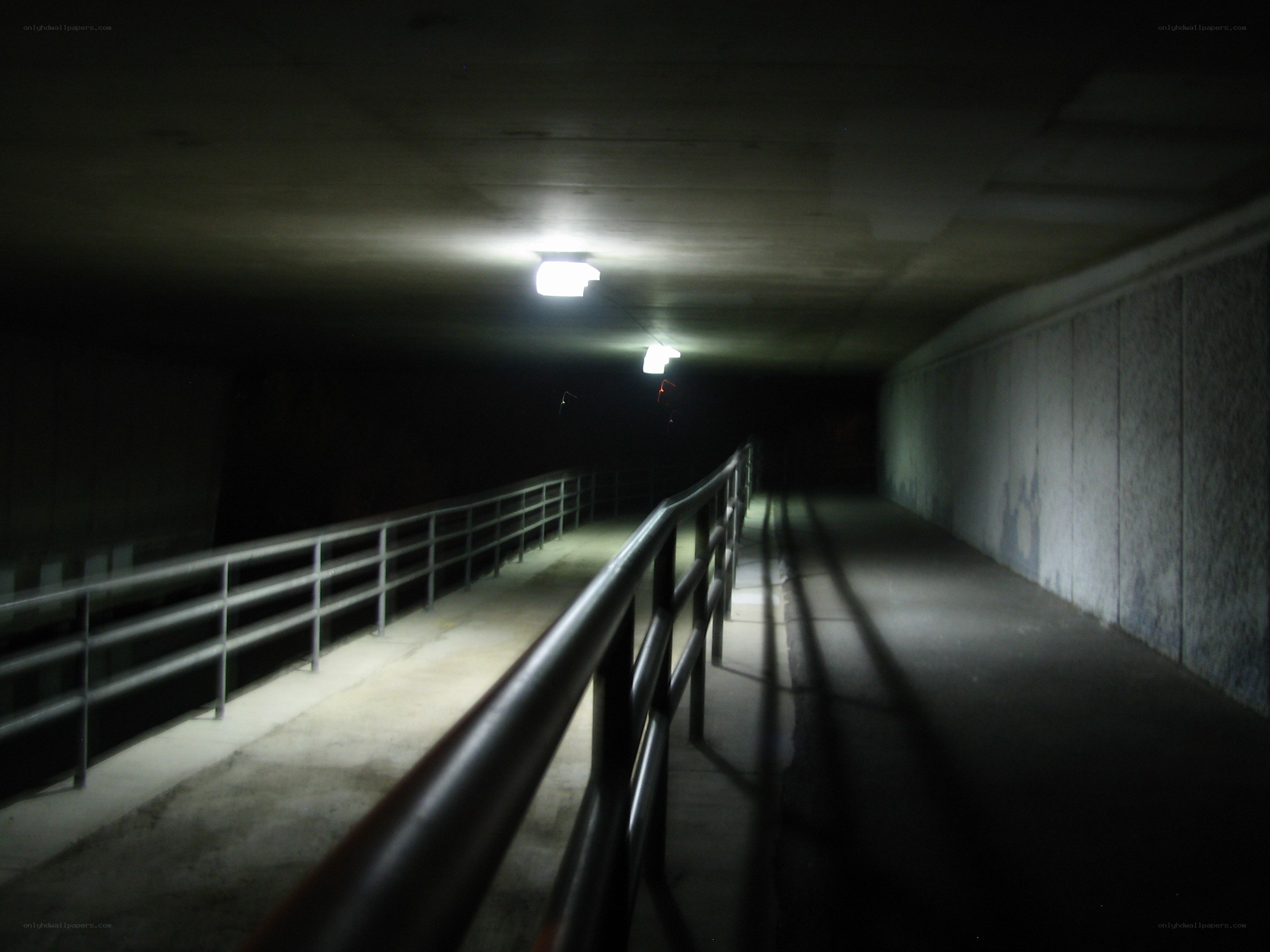 dark tunnel with railings