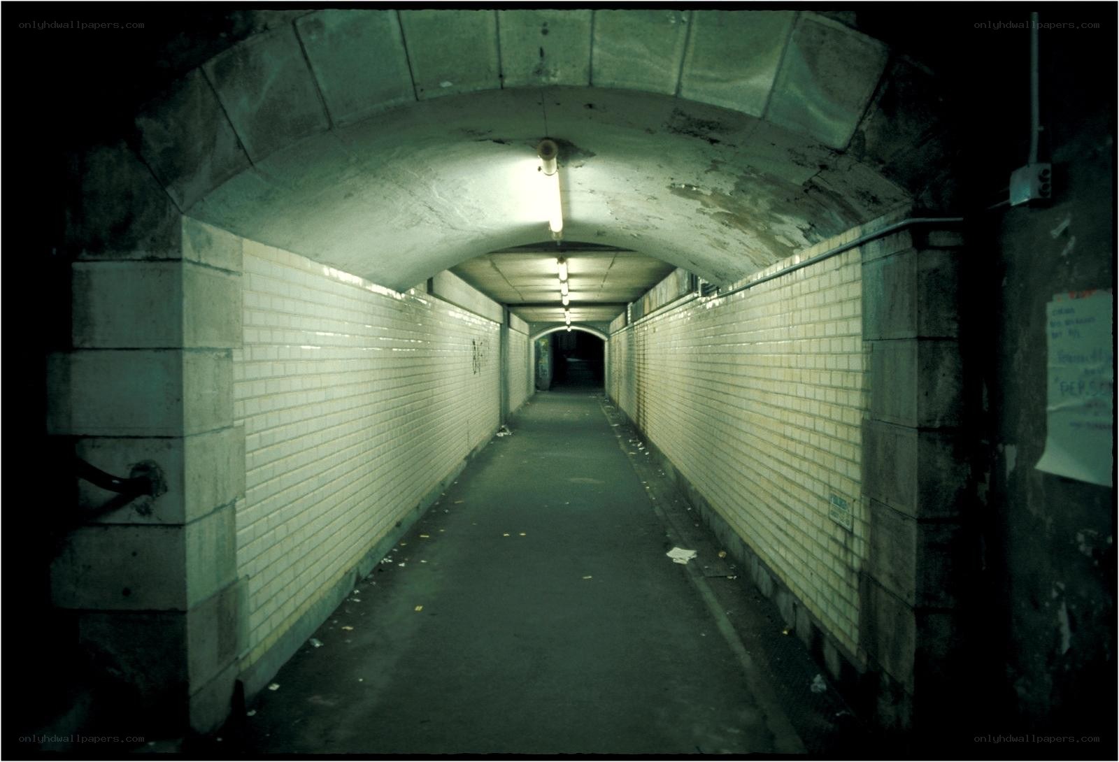 dark tunnel with tiled walls