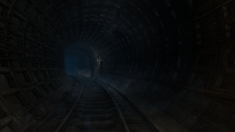 dark tunnel with train tracks