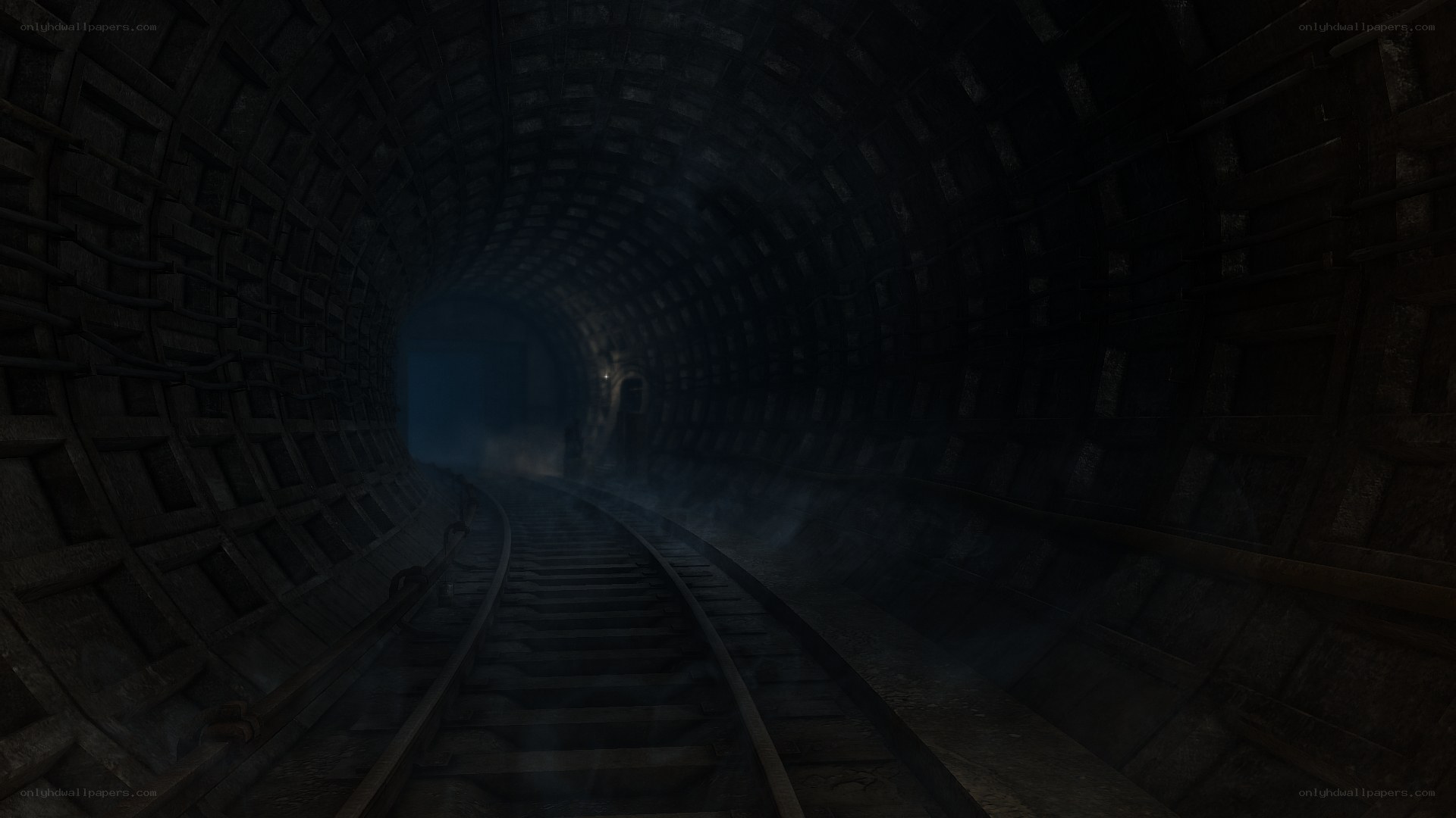 dark tunnel with train tracks