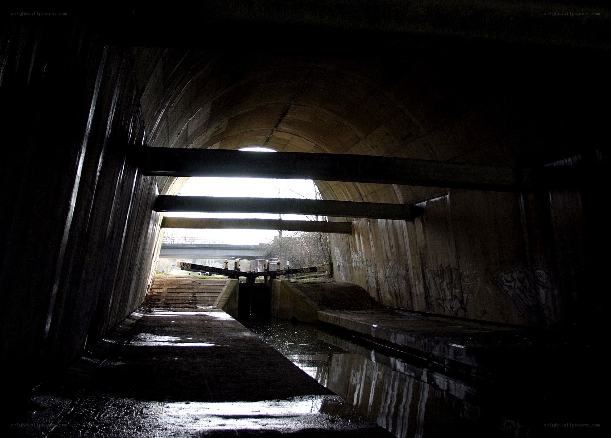 dark tunnel with waterway
