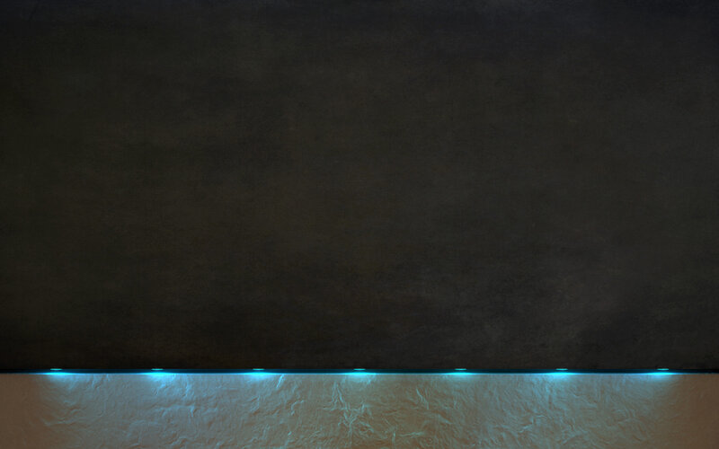 dark wall with blue lighting