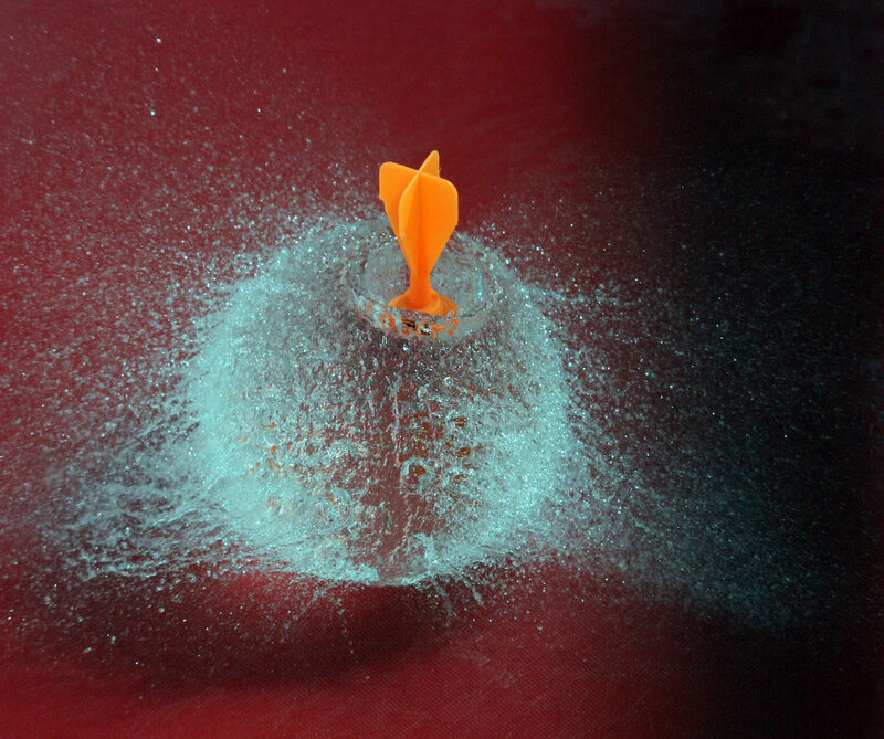 dart hitting water balloon