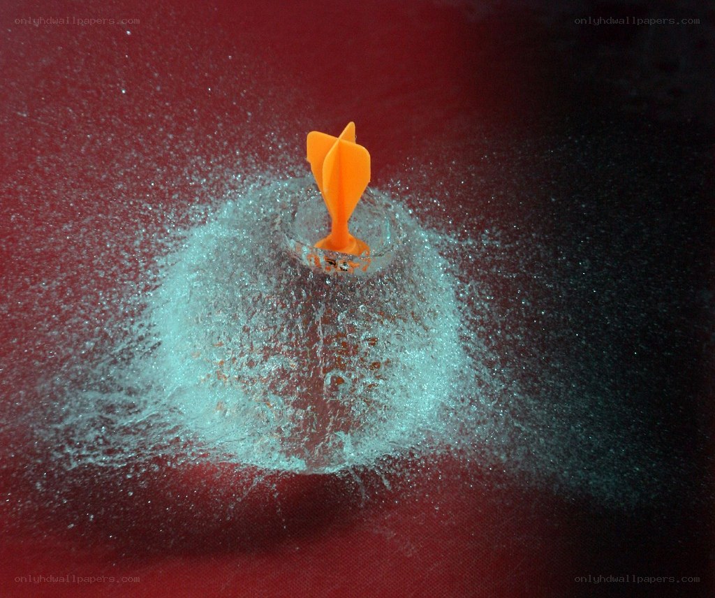 dart hitting water balloon