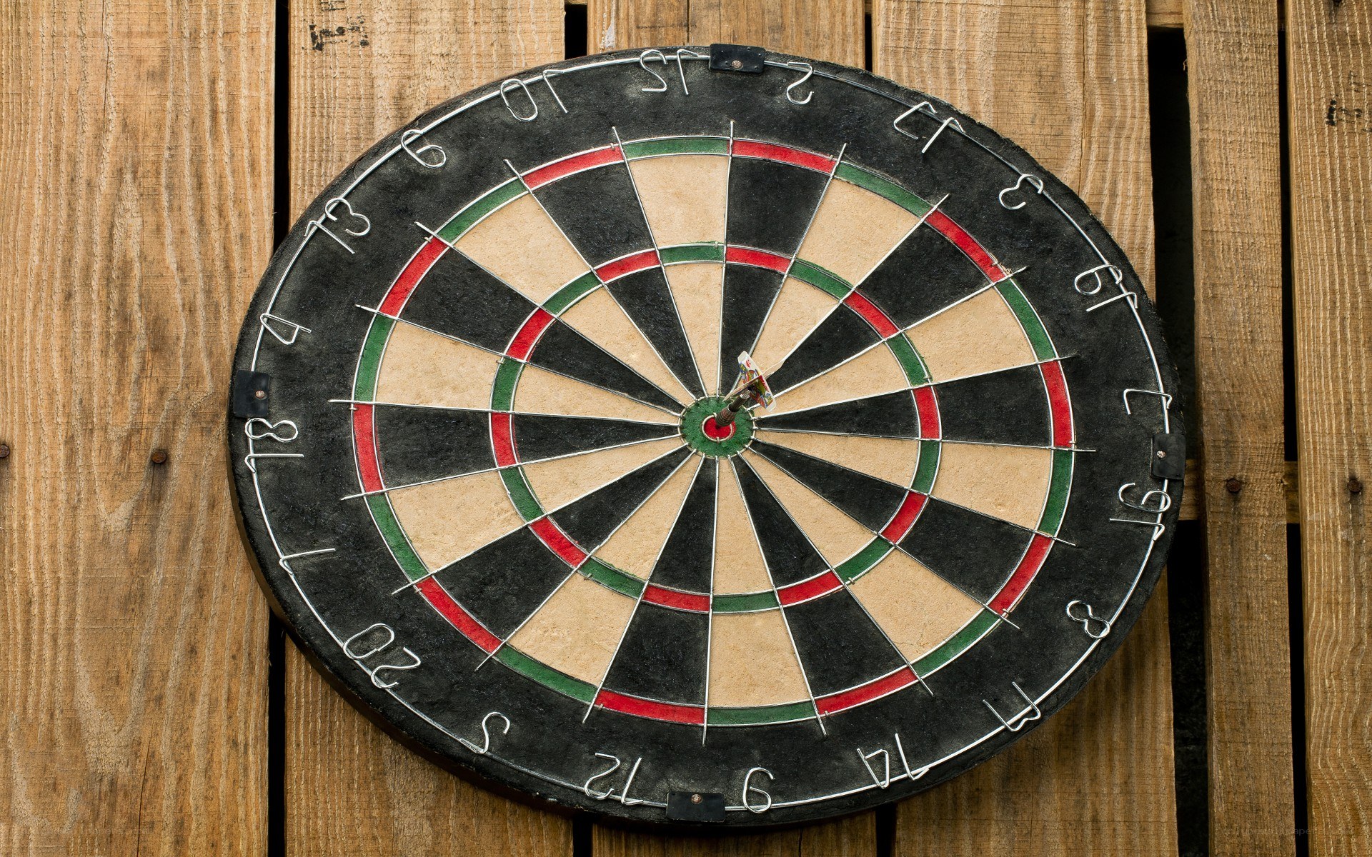dartboard on wooden wall