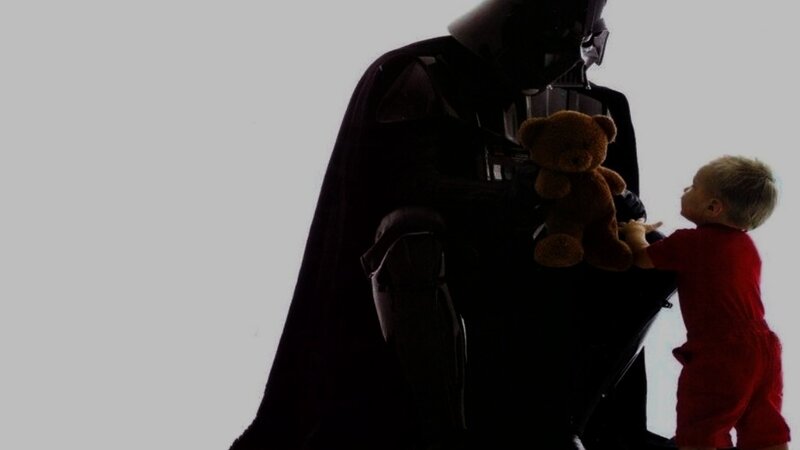 Darth Vader and child with teddy bear