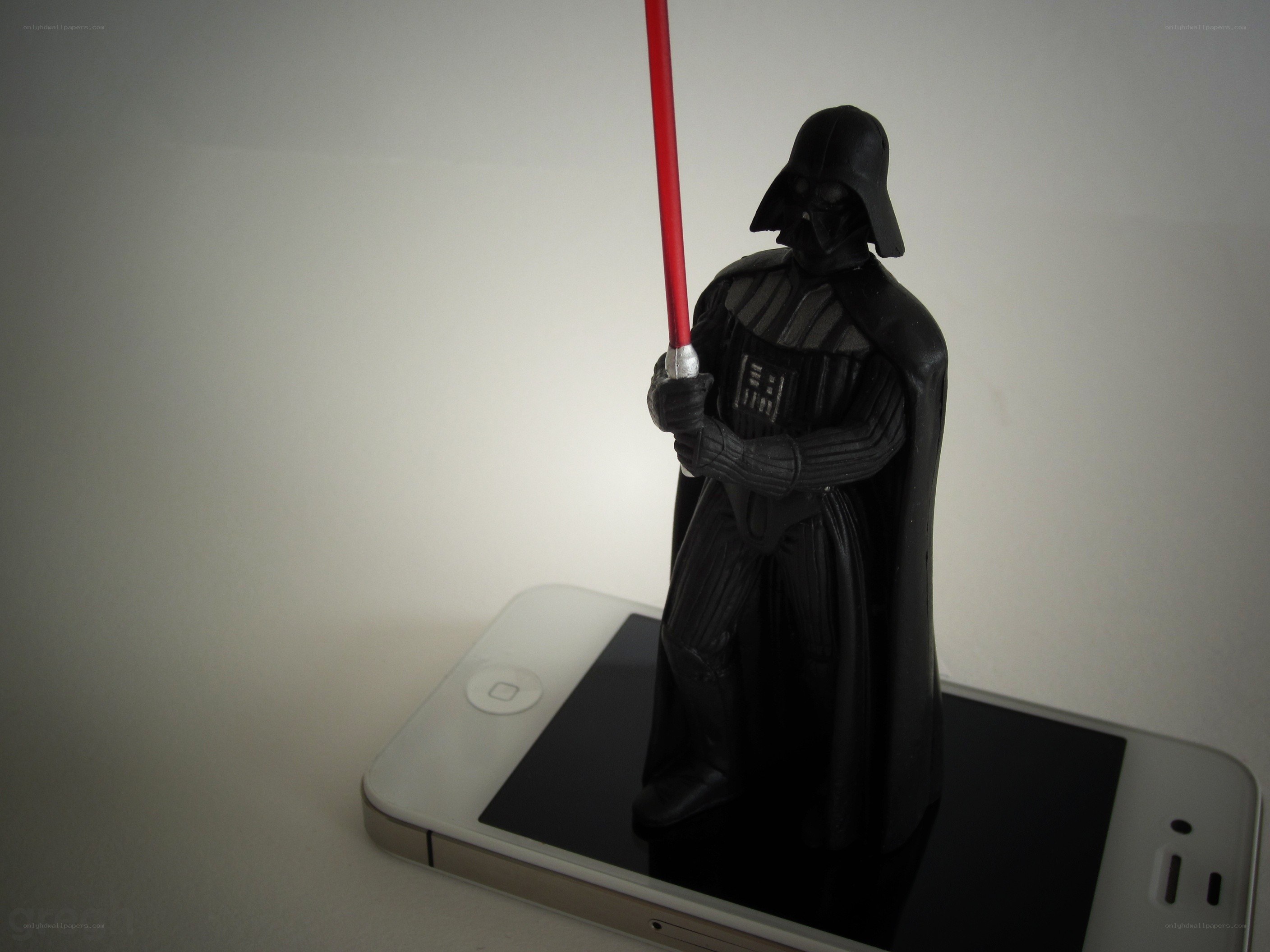 Darth Vader figurine on phone