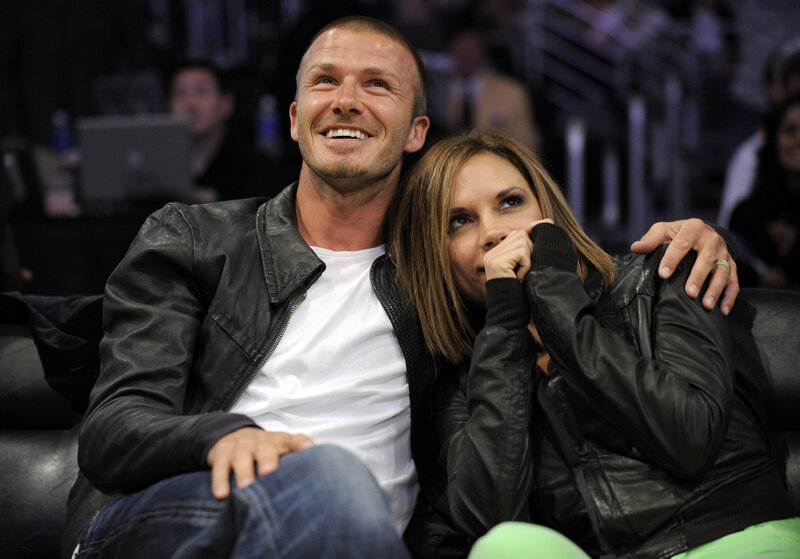 David and Victoria Beckham at a game