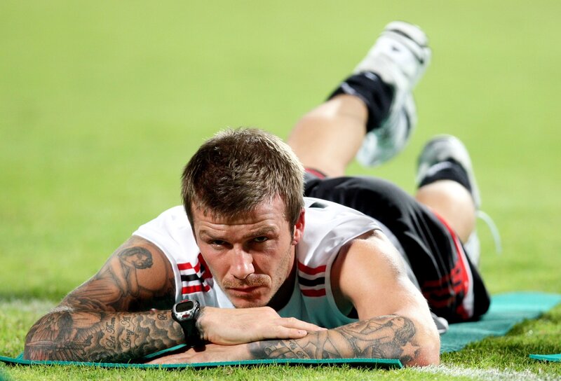 David Beckham stretching on field
