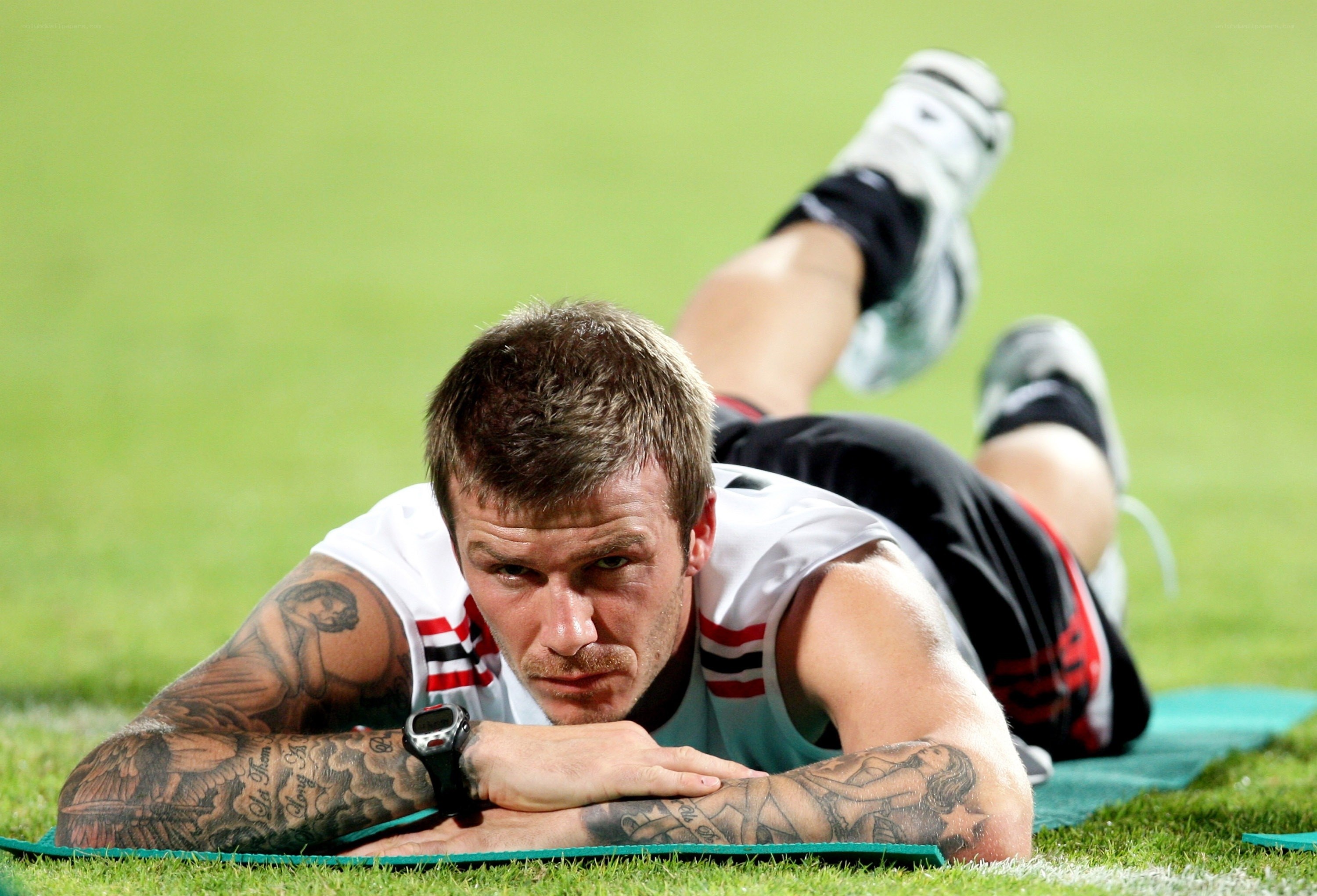 David Beckham stretching on field