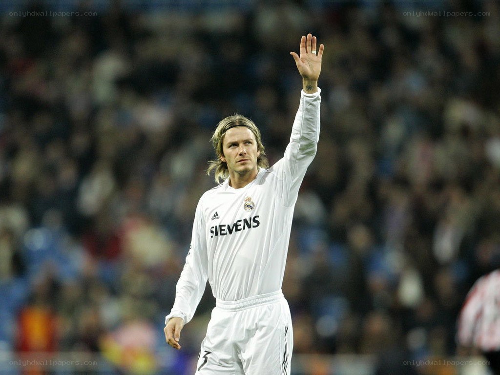 David Beckham waves to fans