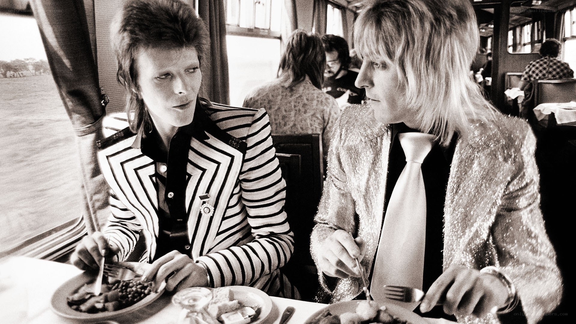 David Bowie and Mick Jagger sharing a meal