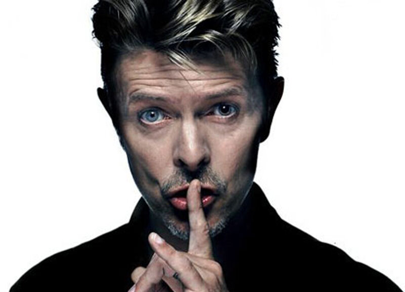 David Bowie making a shushing gesture