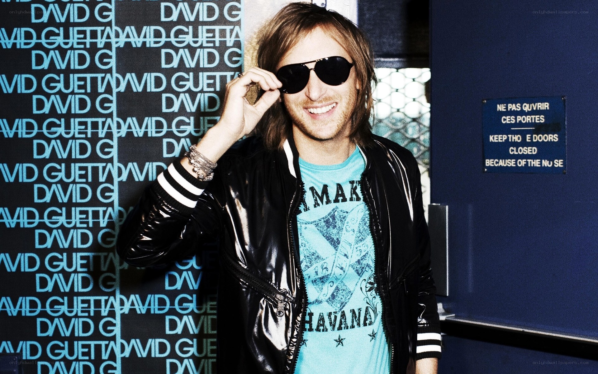 David Guetta smiling in sunglasses