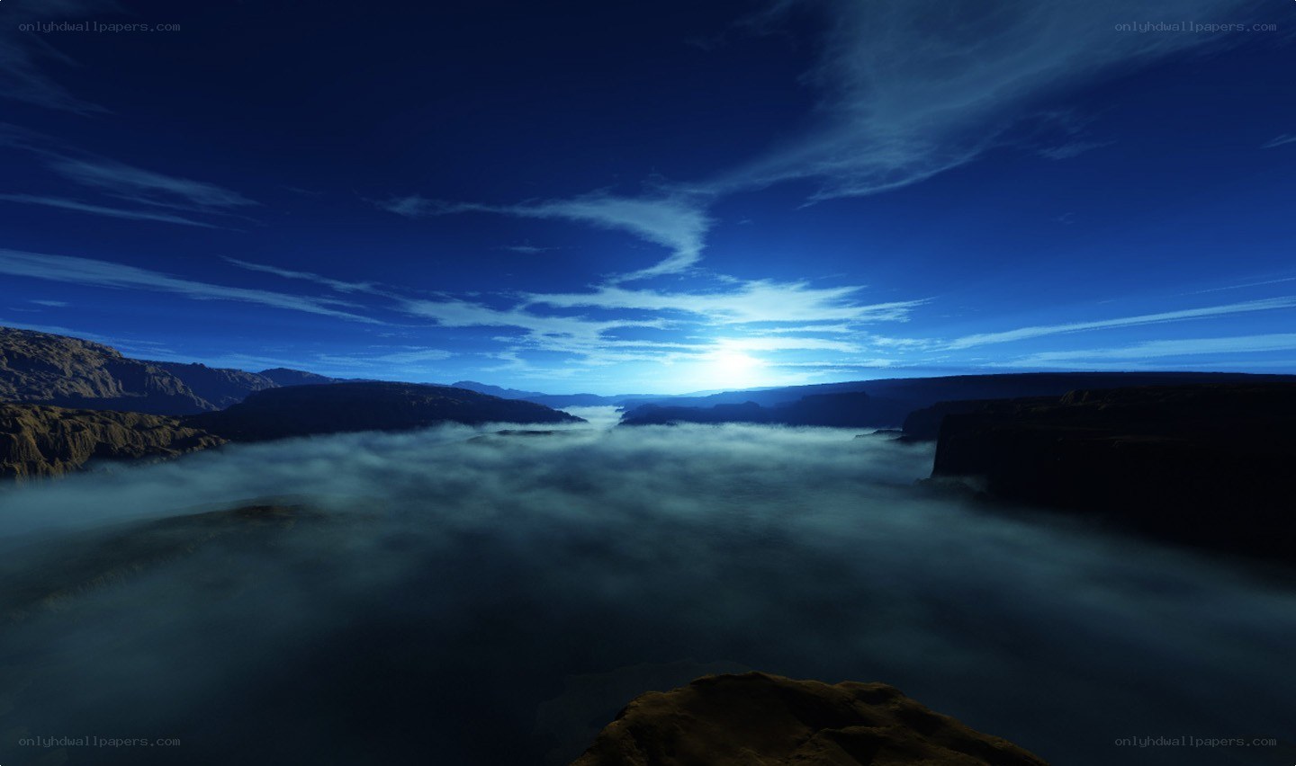 dawn over a misty canyon