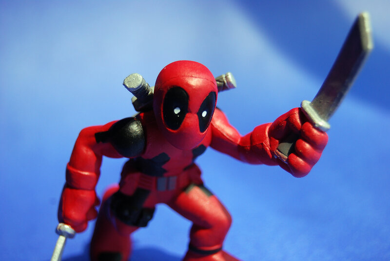 Deadpool action figure with knives