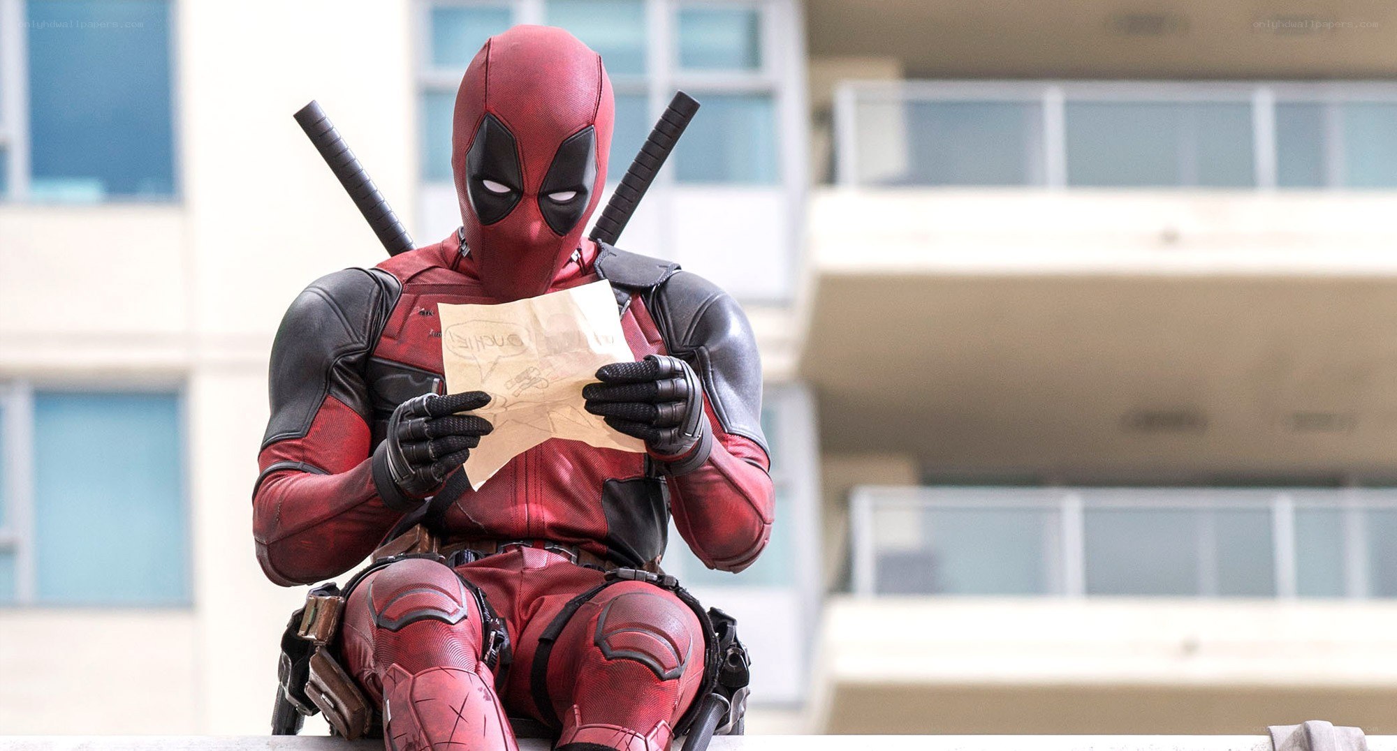 Deadpool reading a note