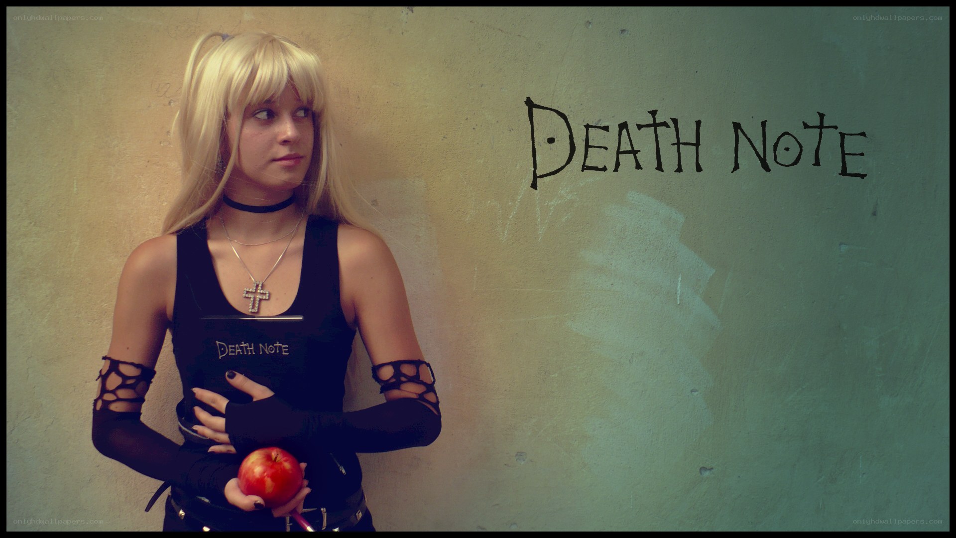 Death Note cosplayer with apple