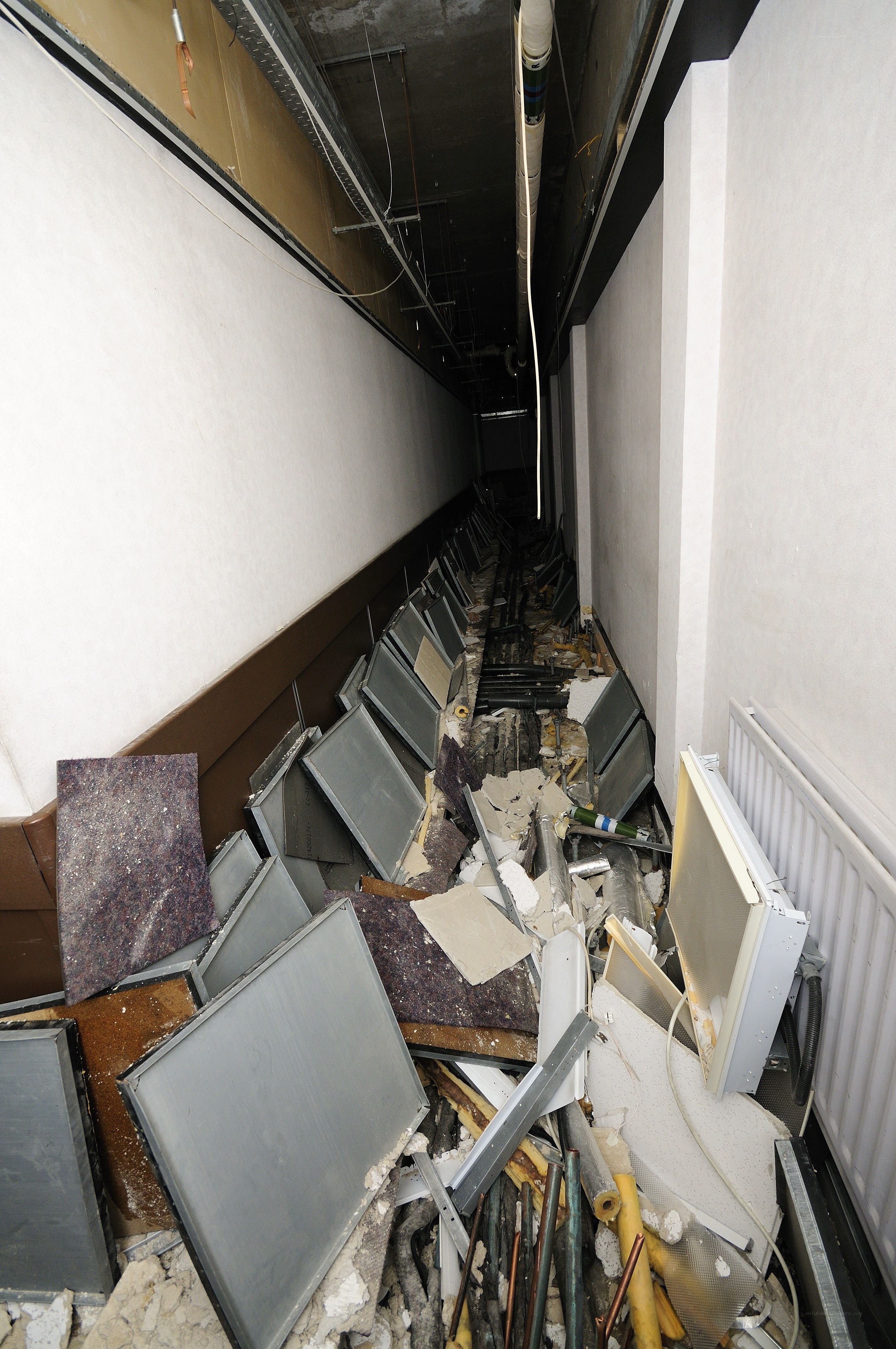 debris-filled hallway after renovation