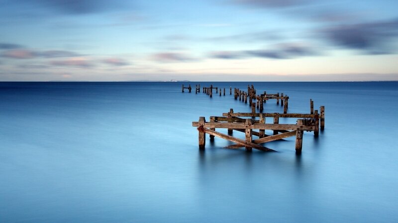 Decaying pier at dusk