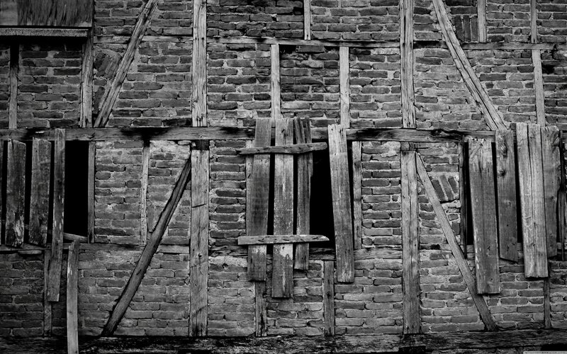 decaying timber-framed wall
