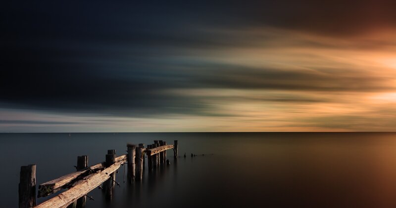 Decaying Wooden Pier — Orange, Dramatic