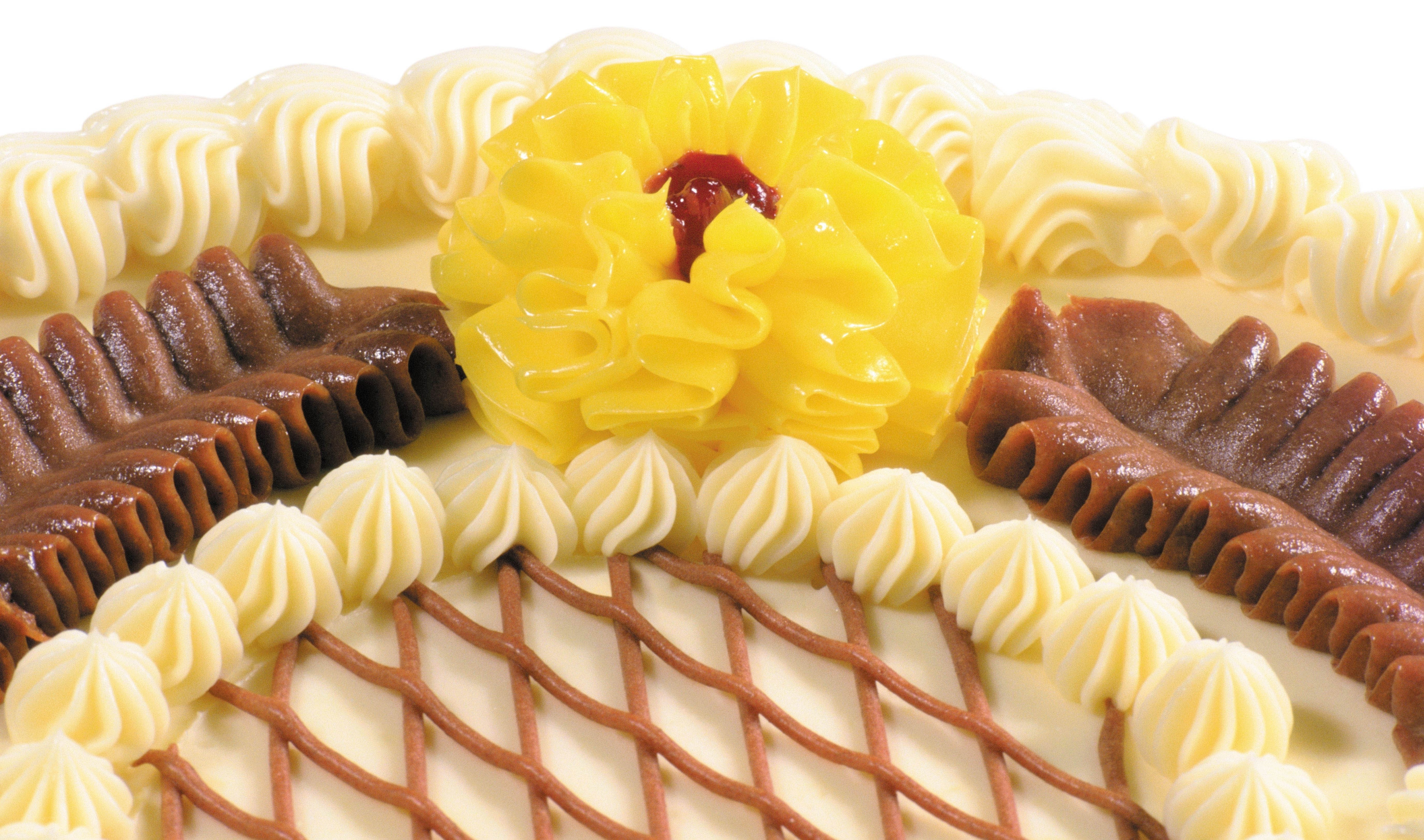 decorated cake with cream and fruit