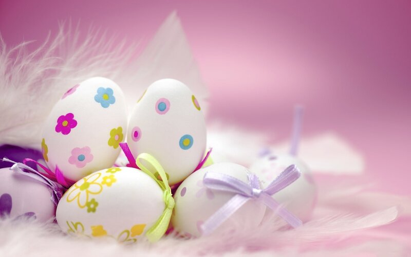 Decorated Easter eggs on feathers