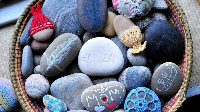 Decorated stones in a basket