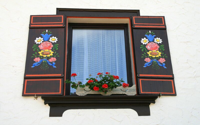 decorated window with shutters