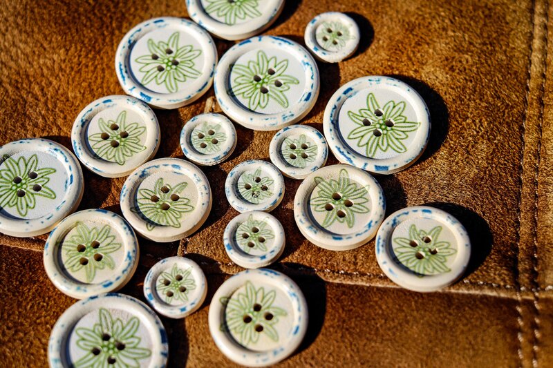 Decorative buttons on leather