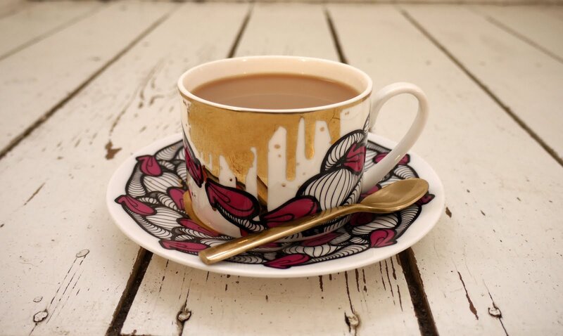 decorative cup with tea