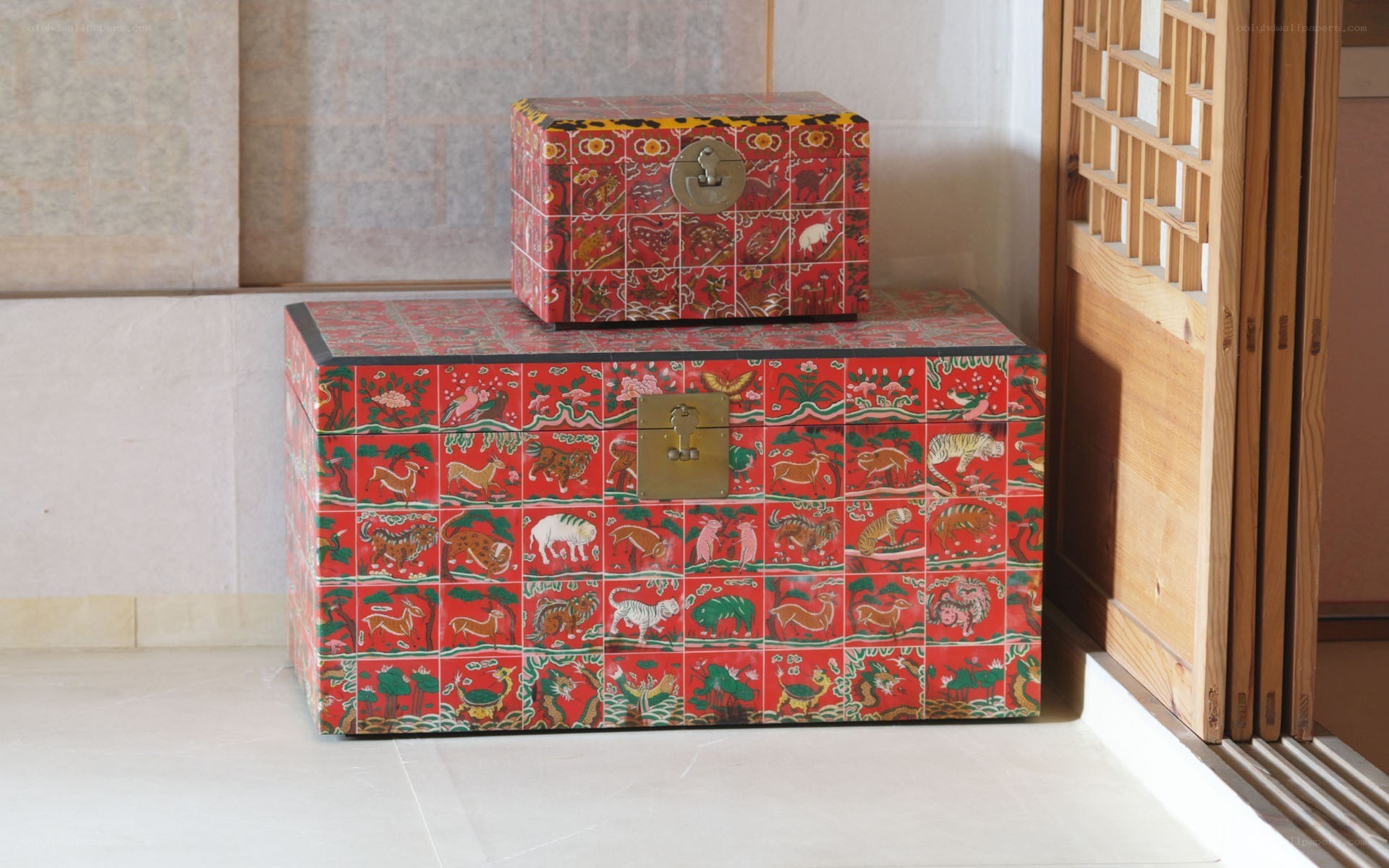 decorative red boxes with animal motifs