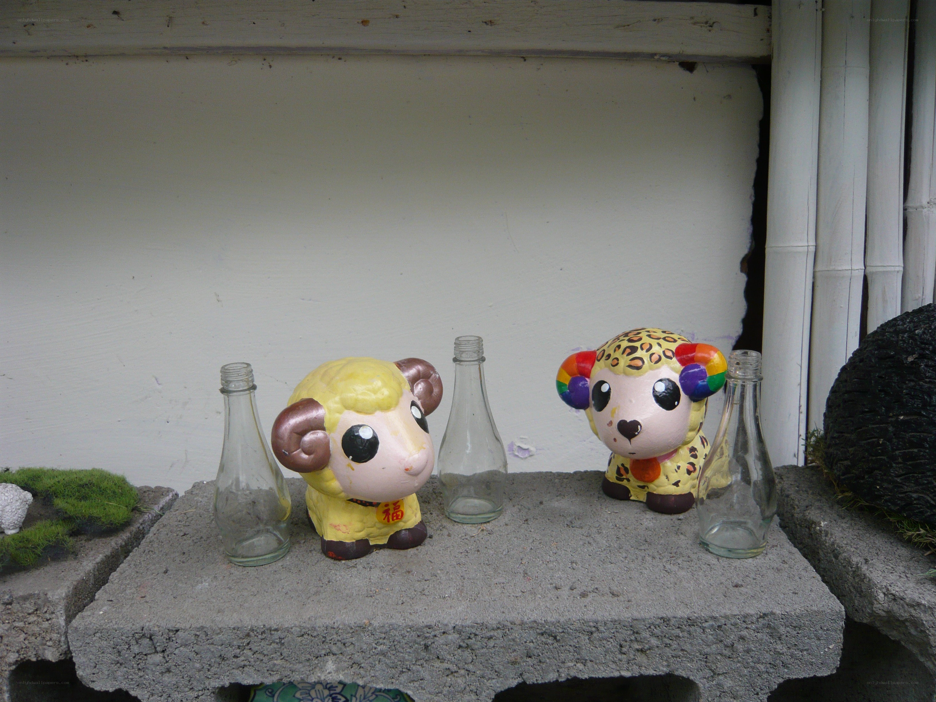 Decorative sheep figurines on concrete