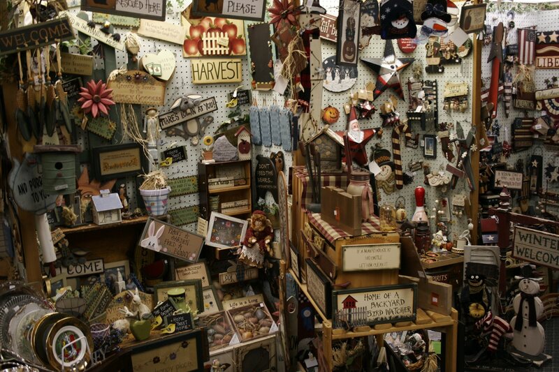 Decorative shop display with signs and crafts
