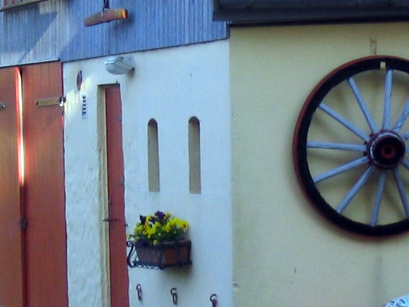 Decorative wheel on a building wall