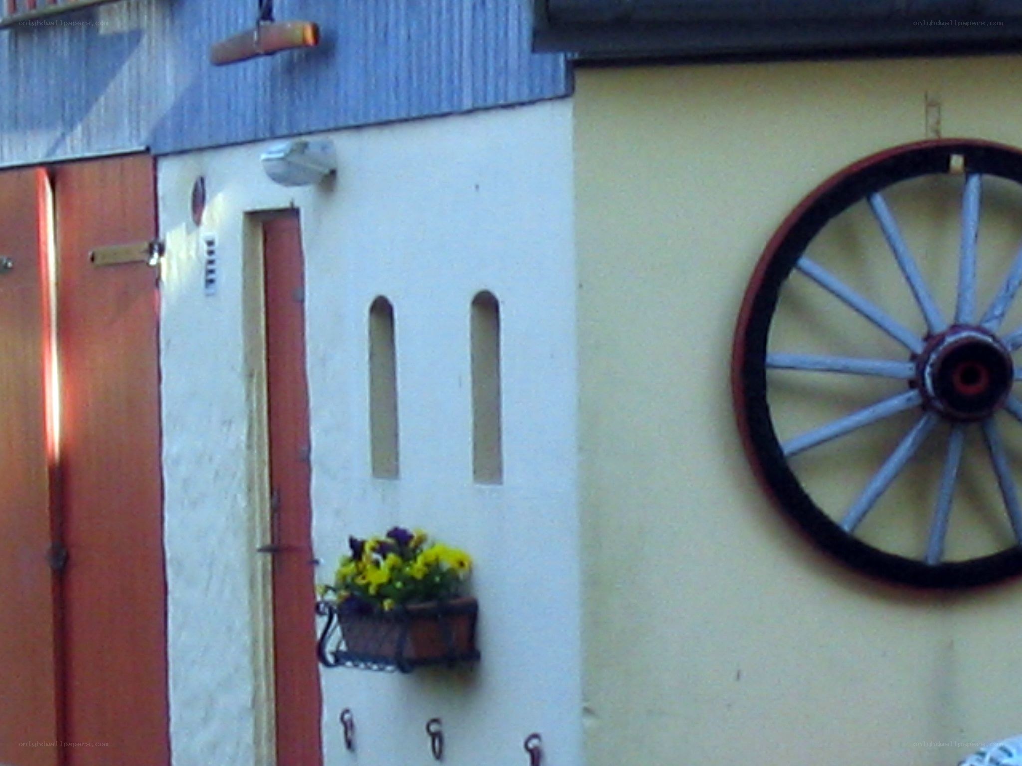 Decorative wheel on a building wall